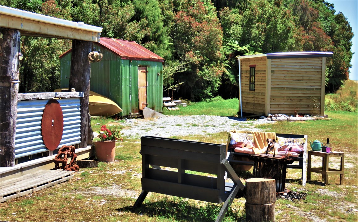 The hut and covered kitchen area