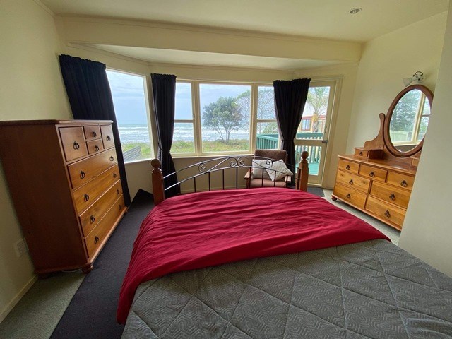 bedroom 2 - Queen with sea views and access to bal
