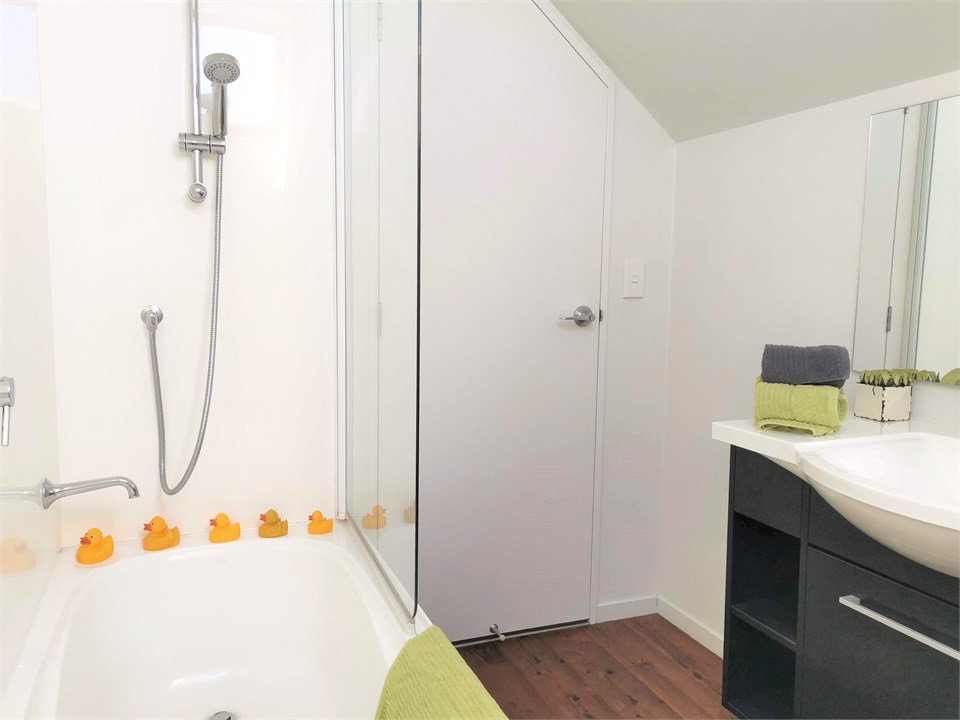 Main bathroom (upstairs) With shower over bath