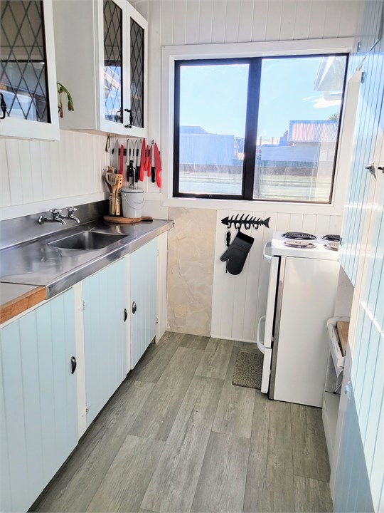 Original galley kitchen with everything you need.