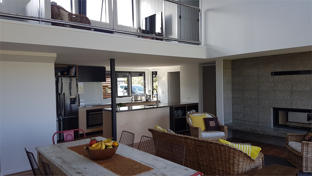 Living area with kitchen and mezzanine above