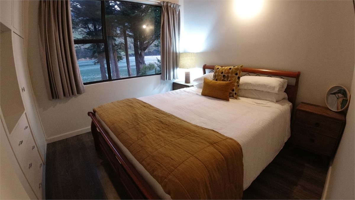 King sized bed with an ocean view