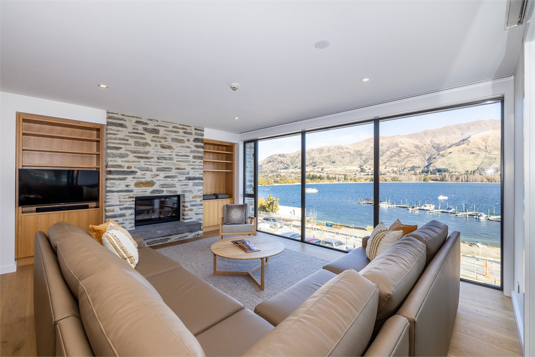 Living room with TV and view of Lake Wanaka