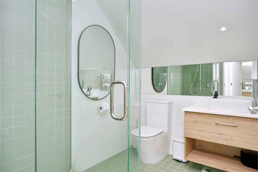 Bathroom has a shower and a toilet