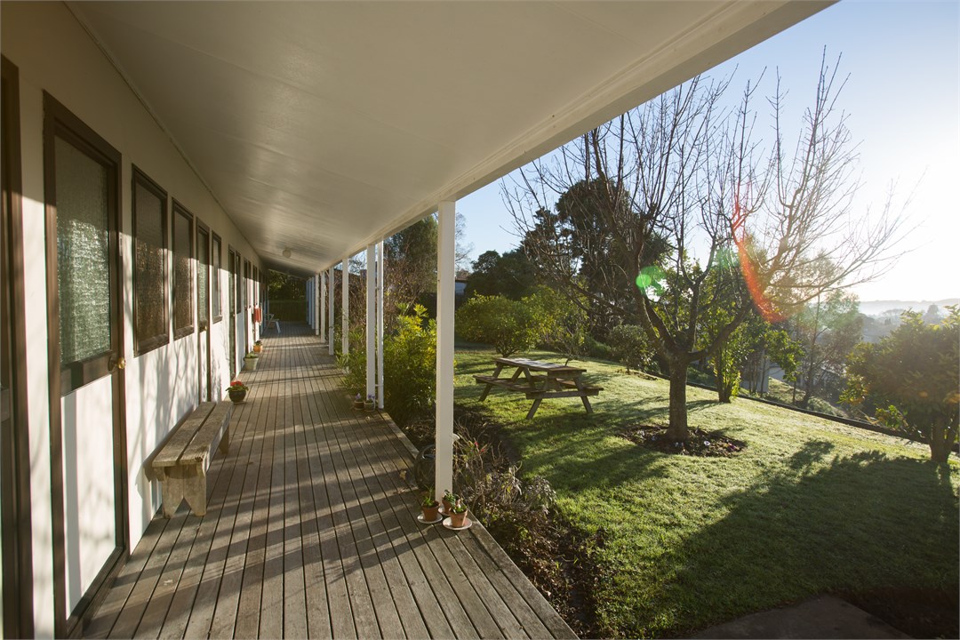 Bedrooms and bathrooms are located off this deck