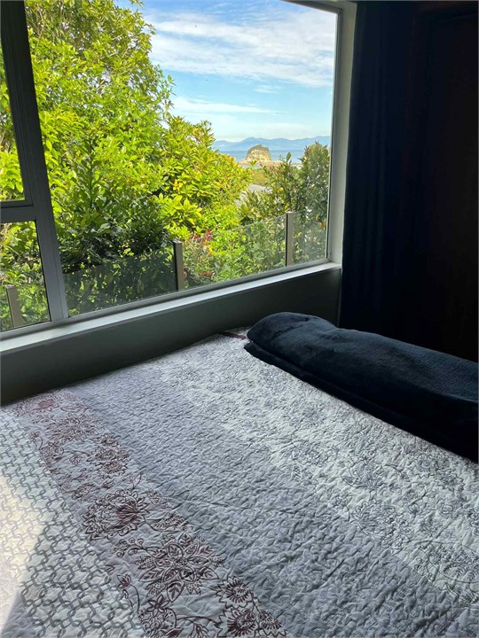 Bedroom 2 view of the beach . New queen bed
