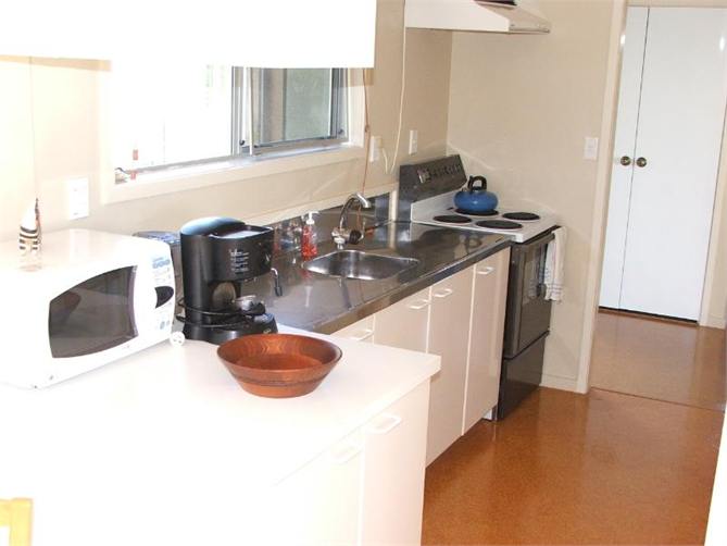 Kitchen with view to enclosed laundry