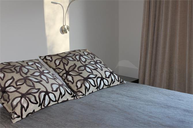 Queen bed with shared bathroom