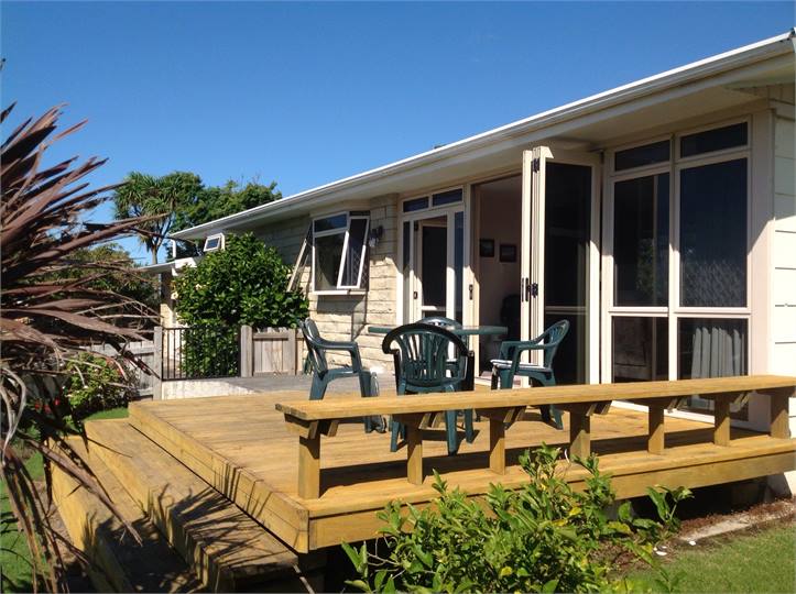 Front view of house, all day sun