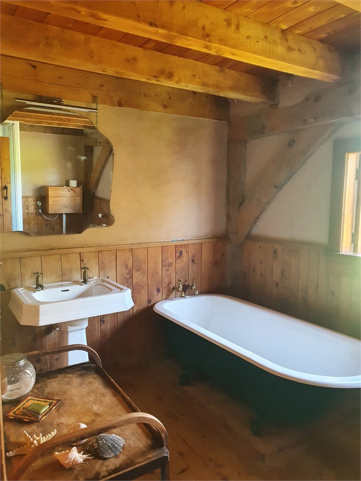 Bathroom with shower and claw bath deep enough to 