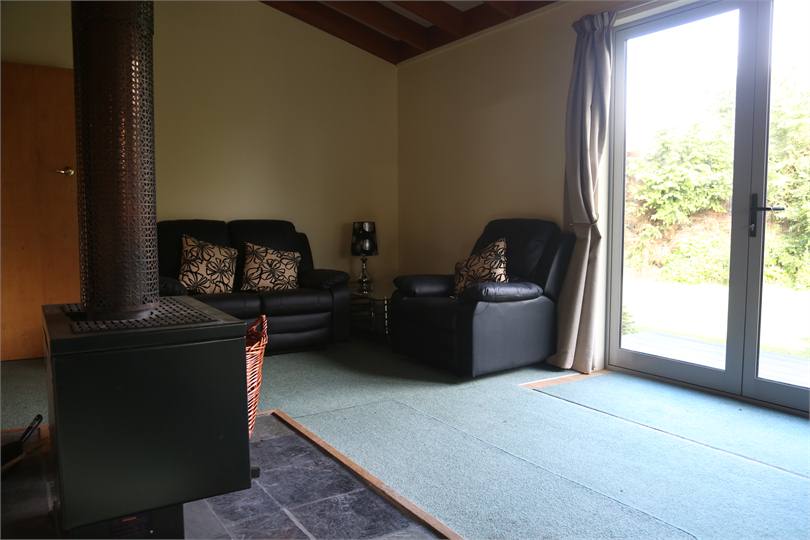 Woodfire in the lounge , opens out onto deck 