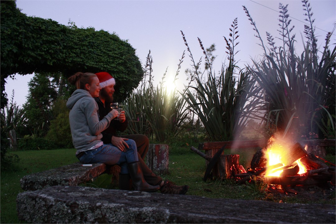 Enjoy a glass of wine by the campfire