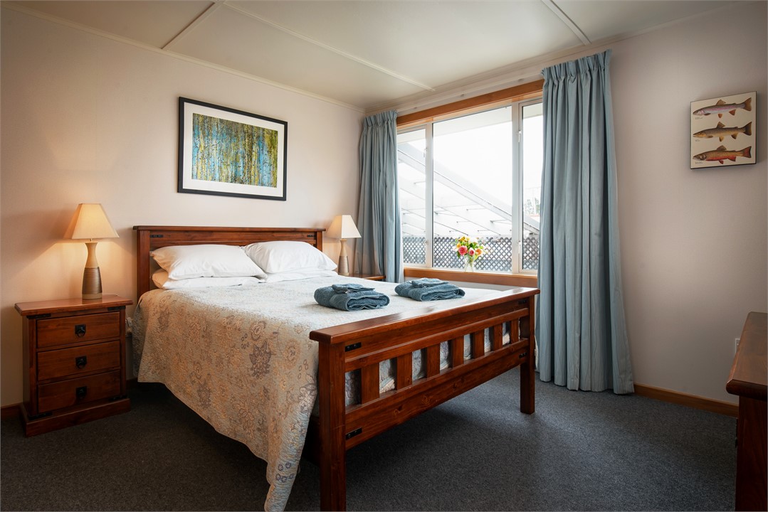 The main bedroom has a queen bed.