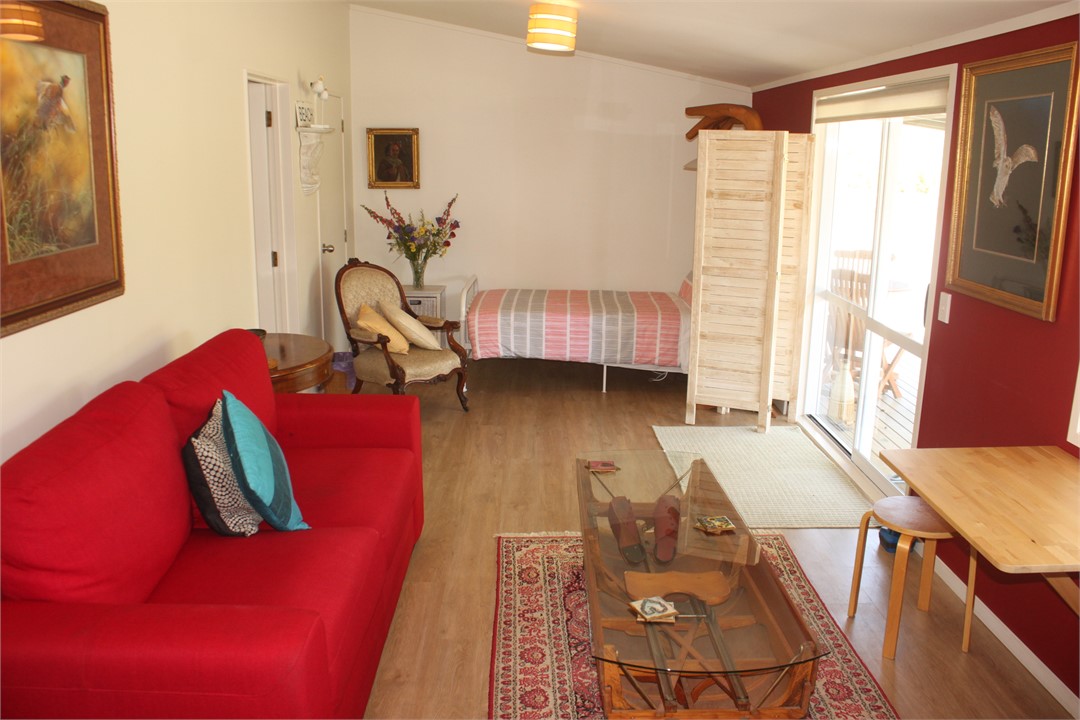 Single bed 9screened) at end of lounge