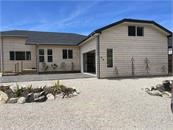 Driveway and view of the house from the street