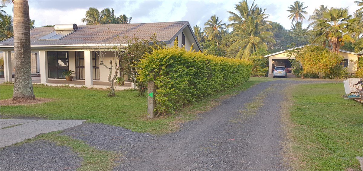 Ruatonga villa on the left within yellow hedge