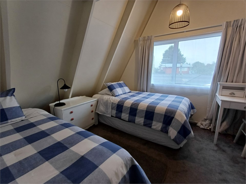 Upstairs bedroom 2 with king single beds