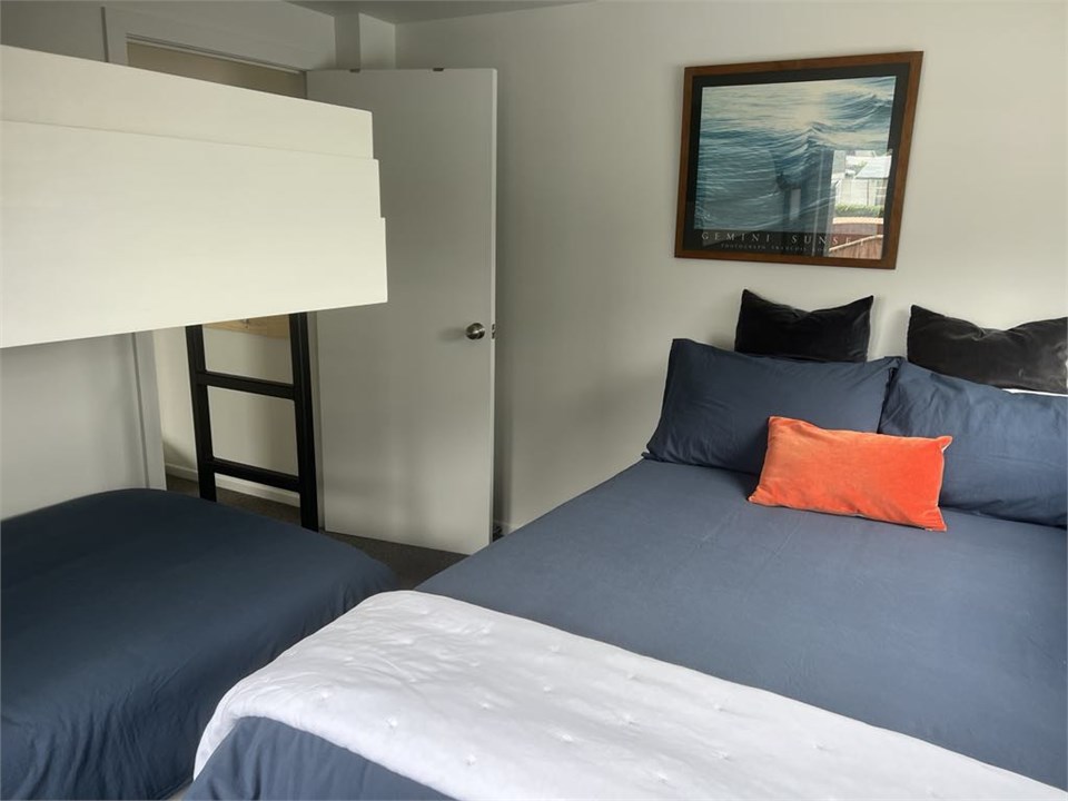 2nd room 1 queen bed 1 king bunk