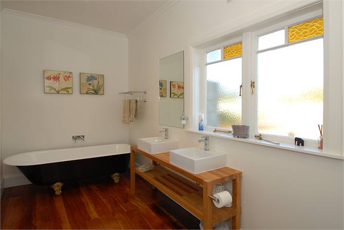 Bathroom with clawfoot bath and separate shower