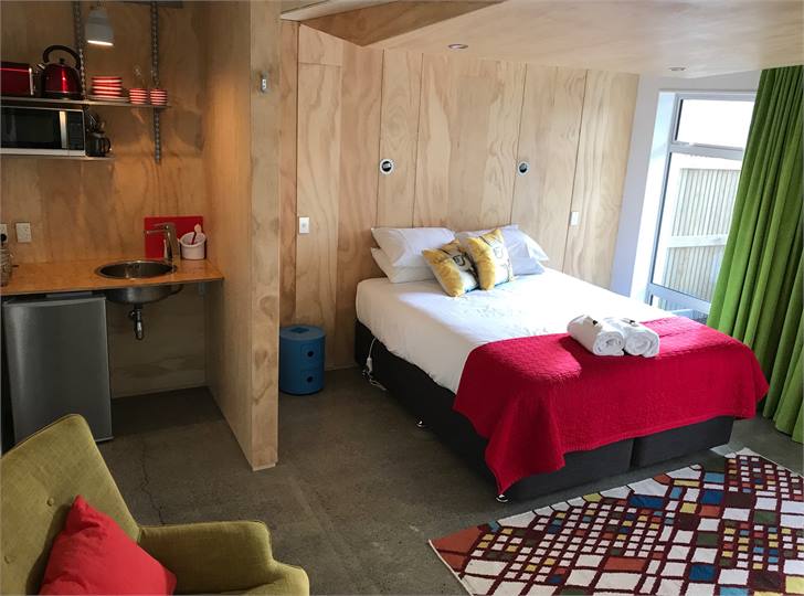 Kitchenette with microwave, fridge, kettle and toa