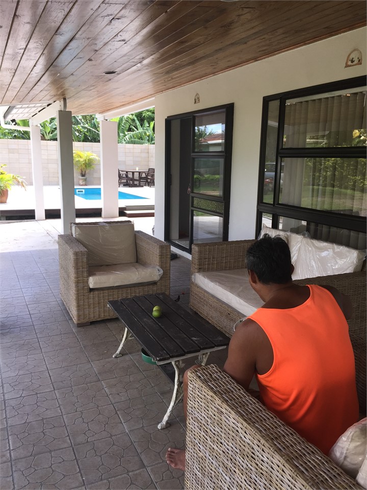 veranda, pool in background