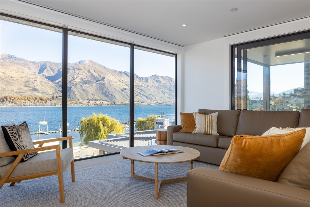 Living room with TV and view of Lake Wanaka