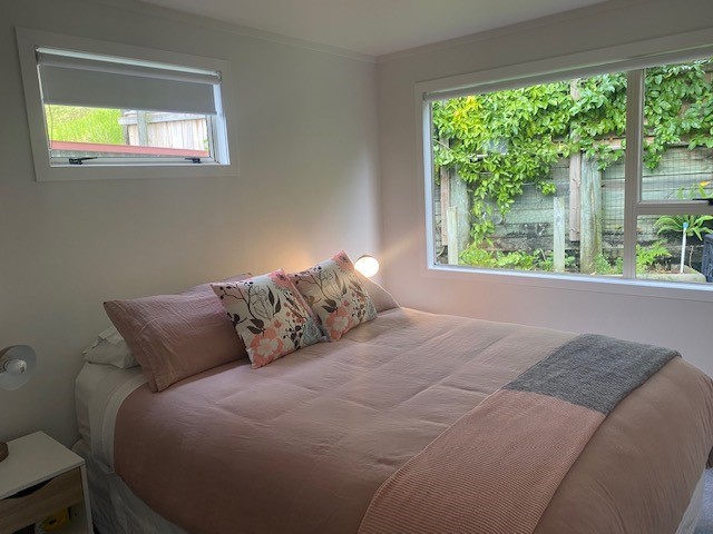 Second bedroom, queen size bed, with view to passi