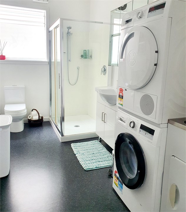 Bathroom with shower & laundry.