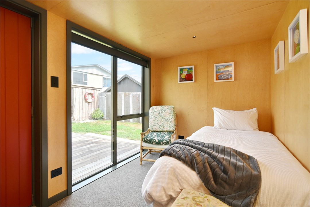 Bedroom 2 has a Single bed and a seating area