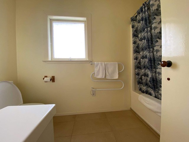 Upstairs bathroom - shower over shub, toilet and v