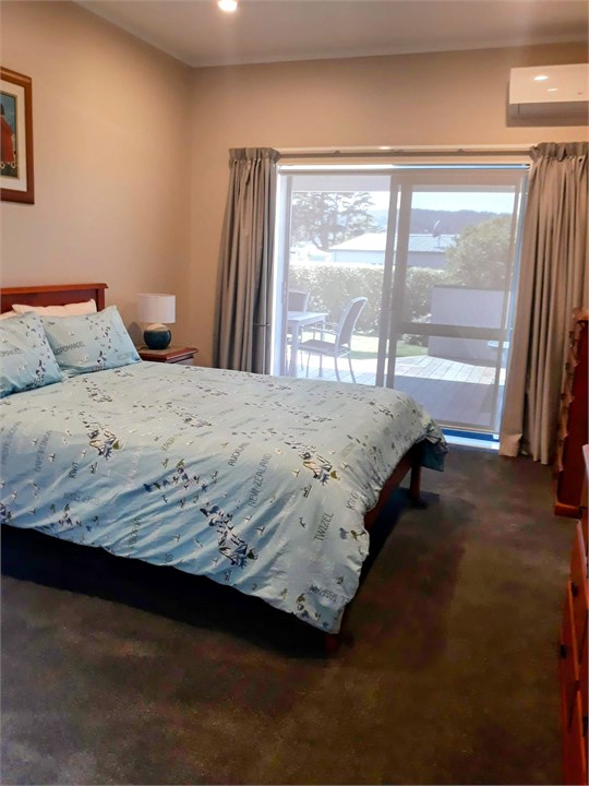 Main Queen bedroom with heat pump