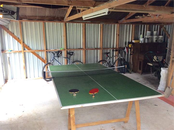TT Table and bikes in garage.