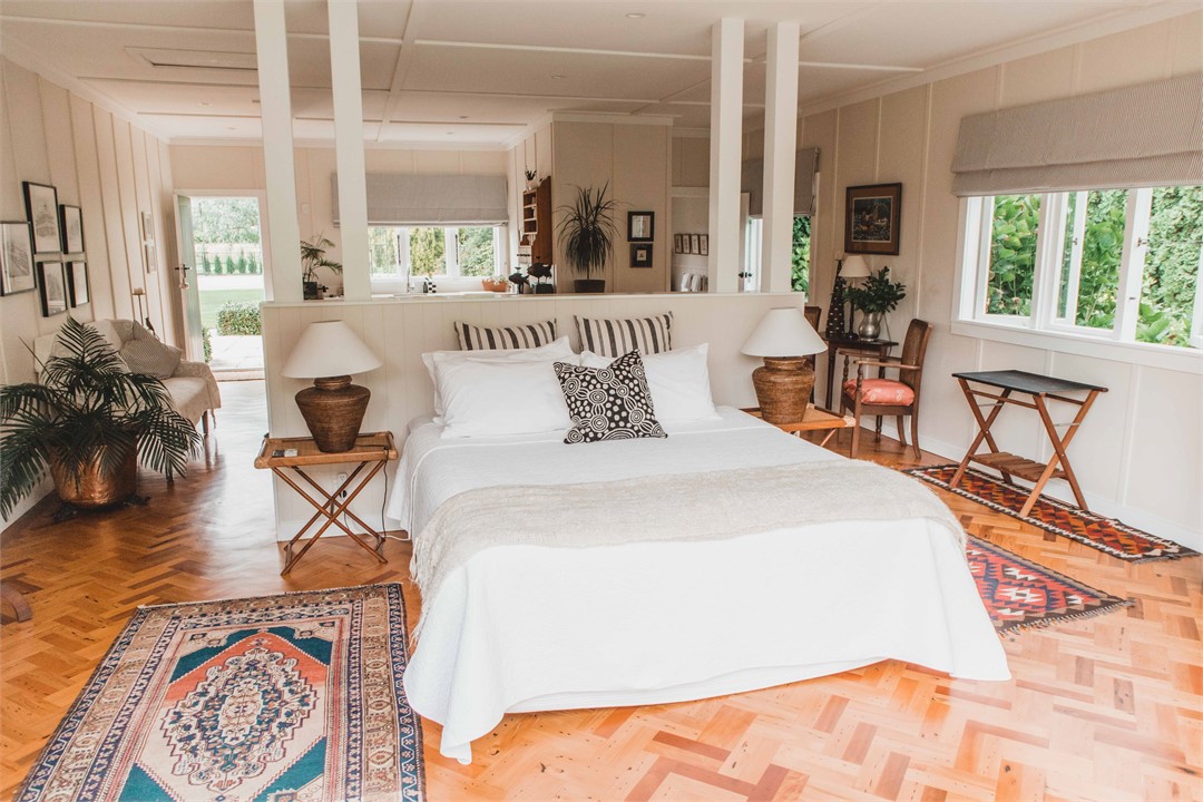 Self contained  open plan studio showing king bed 