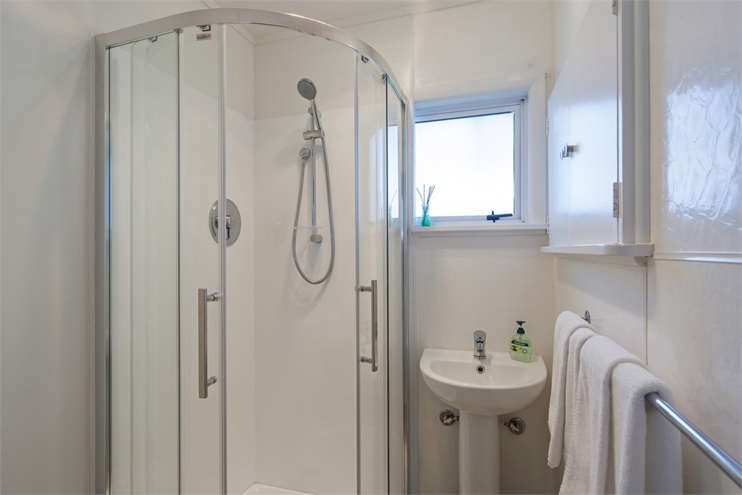 Main bathroom w/ Shower & Vanity. Separate toilet