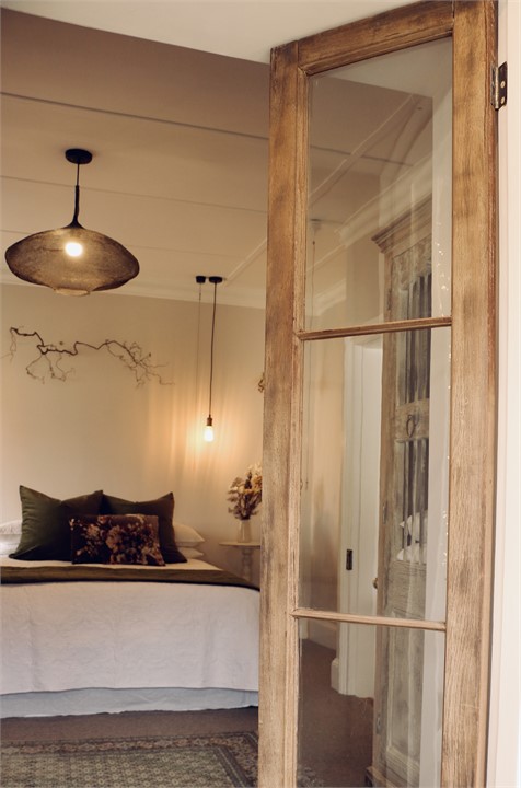 Elegant master bedroom with sunroom and garden acc