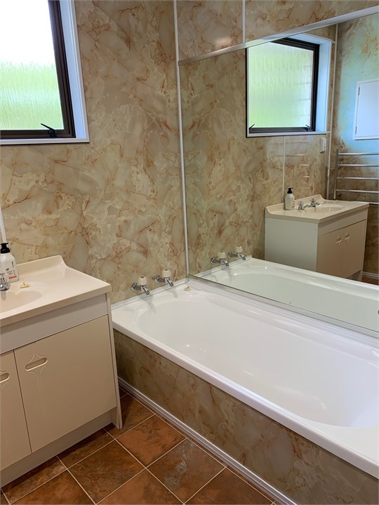 Main bathroom has bath as well as shower