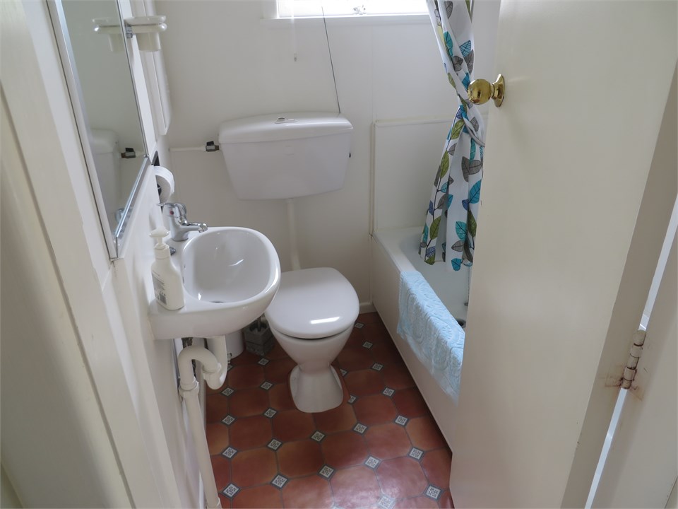 The bathroom is downstairs