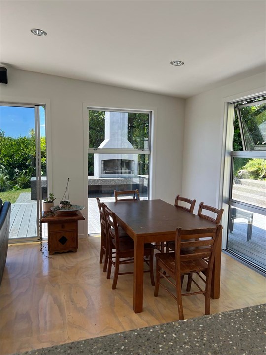 View from kitchen to outdoor fireplace