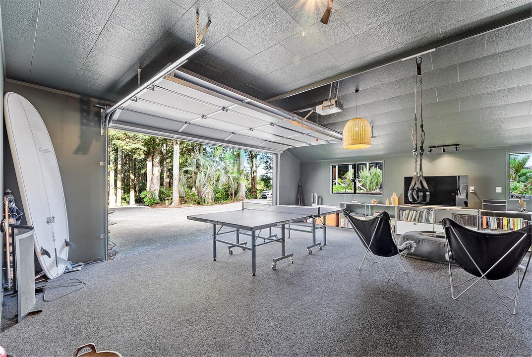 Garage area with table tennis and TV room