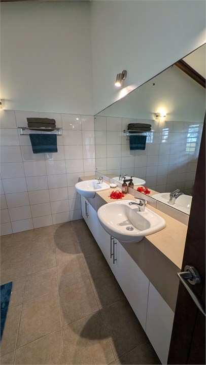 Bathroom - twin sinks, walk in shower and toilet