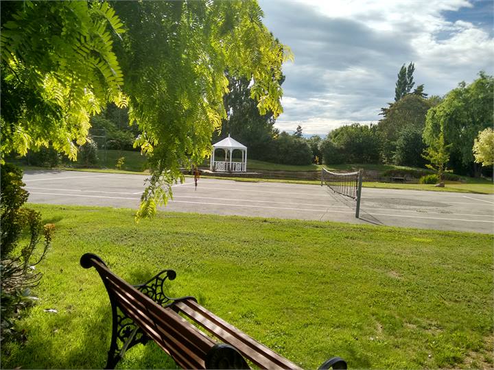 Tennis court view across to pond from 1 of many se