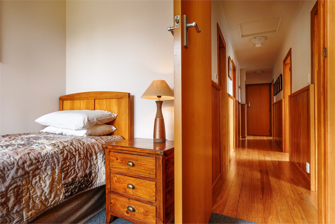 The fourth bedroom has a long single bed.