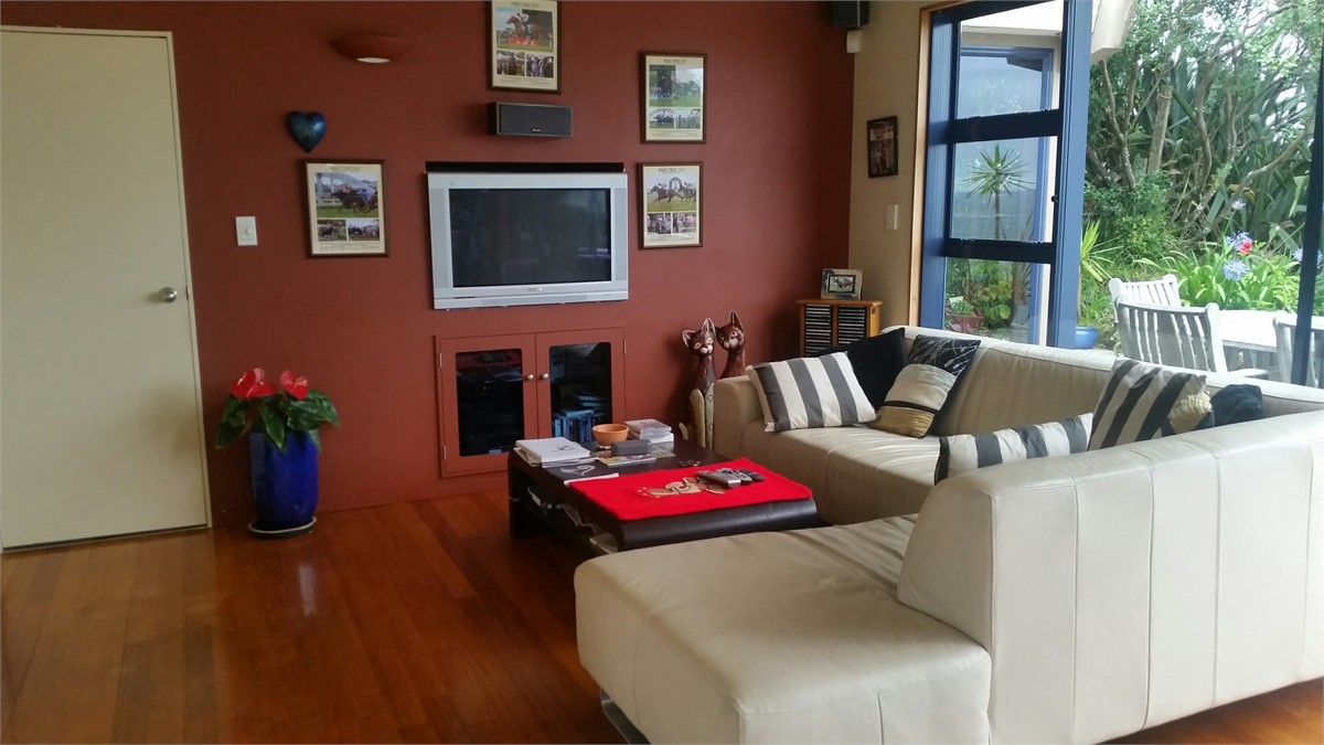 Comfy lounge, timber floors with views thru r/slid