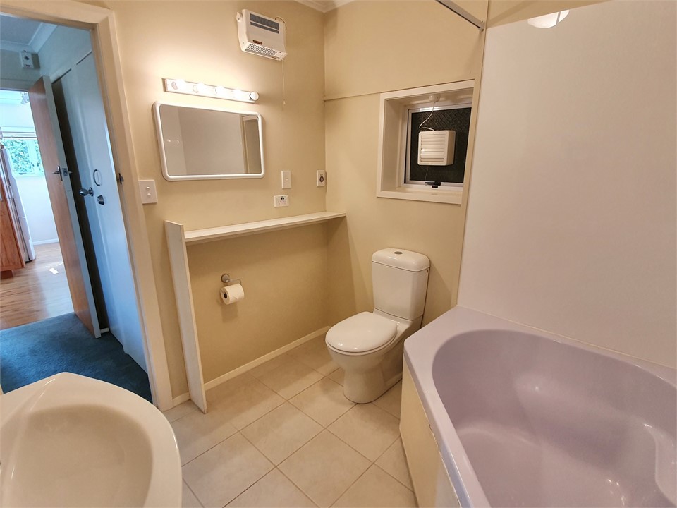 Bathroom with Shower over Bath, Toilet & Vanity