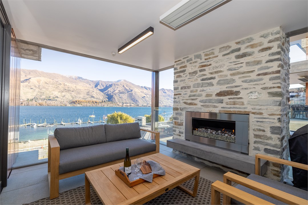 Balcony area with outside sitting and a BBQ