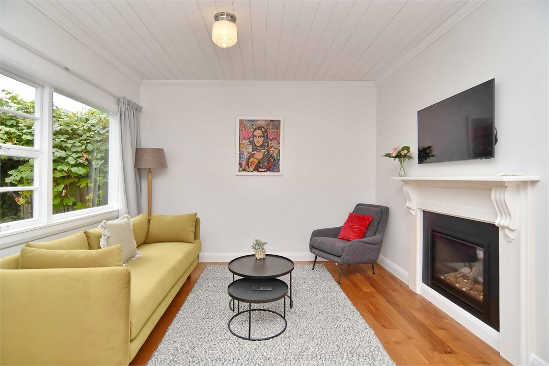 Living area with a TV and gas fire