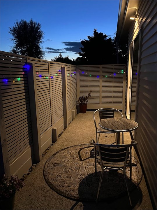 Private guest patio at night