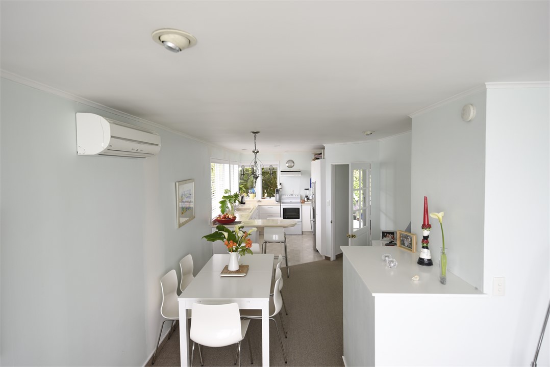 Living area looking to kitchen