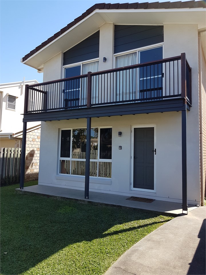 Front of Townhouse & grassed Courtyard.