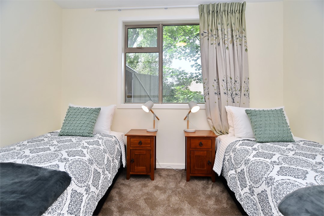 Bedroom 3 includes two single beds and a view of t
